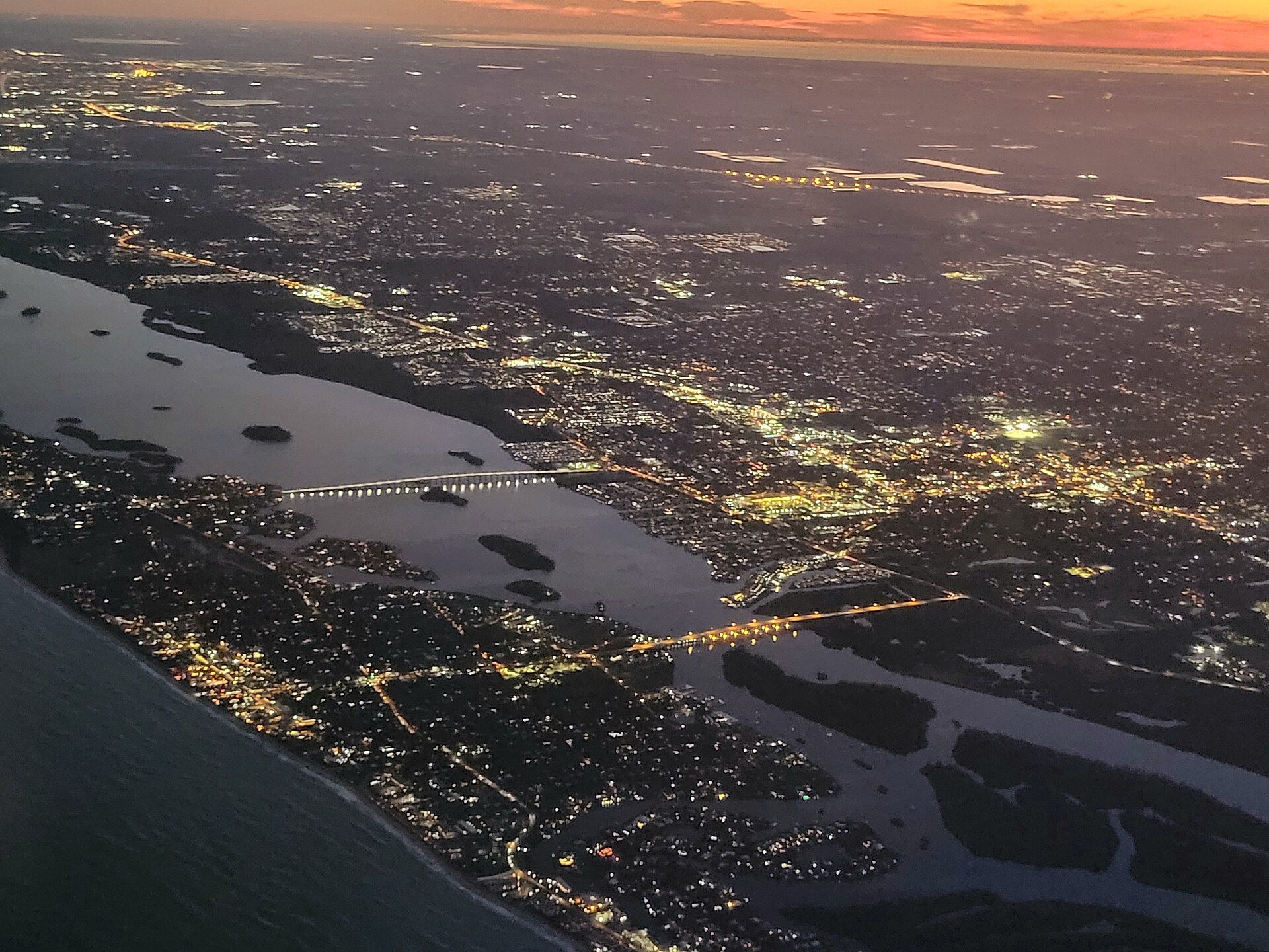 Aerial evening view of Vero Beach, Florida, with the Indian River Lagoon and causeway bridges